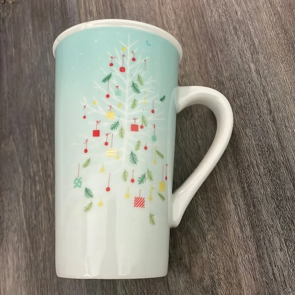 Starbucks Coffee Mug 2019, Tall 16 Oz. Christmas Tree on Light Blue Background.